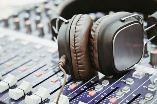 close up of Headphones on sound mixer background