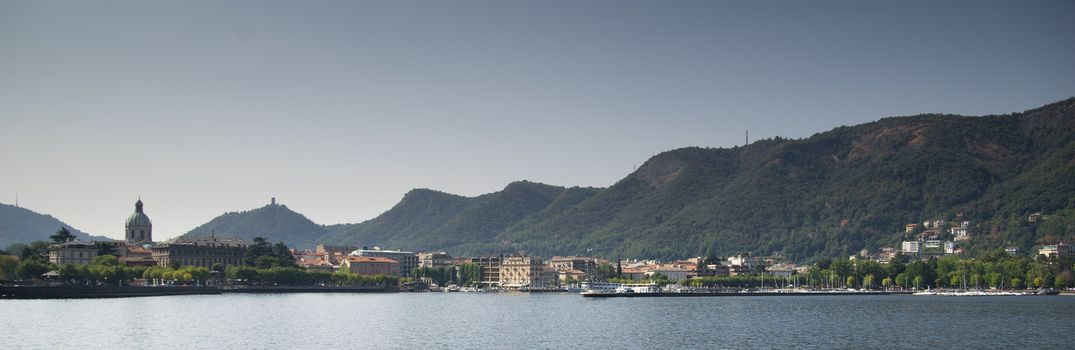 Como lake landscape with boats and water in summer travel