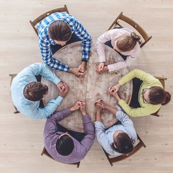 Businessteam working at empty meeting table, top view