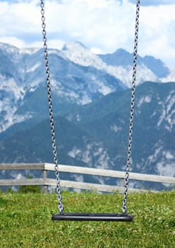 Swing with chains on top of the mountain
