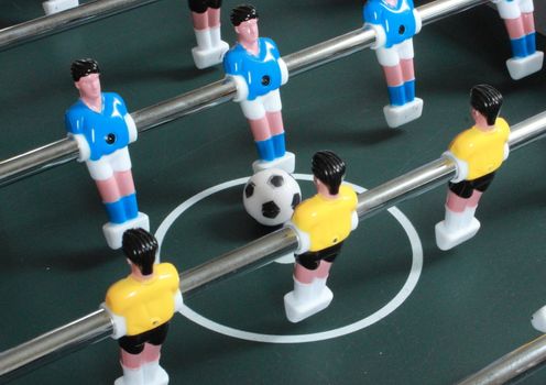 Football table game with blue and yellow players