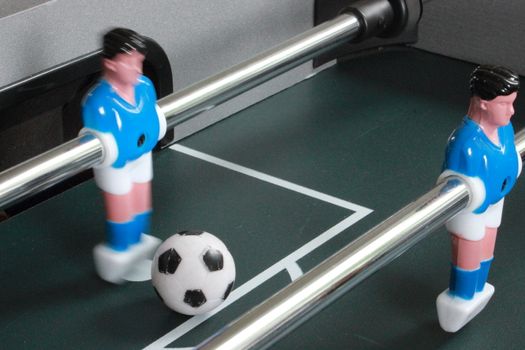 Football table game with blue goal keeper