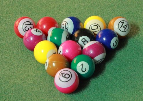 Pool balls on green cloth - triangle