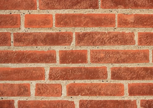 Red brick wall with grey mortar