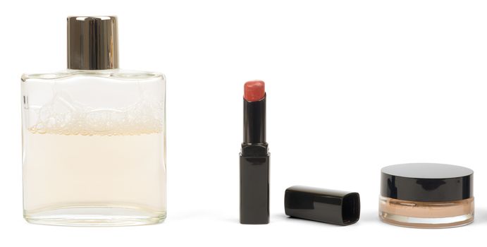 Lipstick, powder and perfume isolated on white. Cosmetics