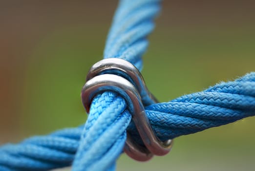 Metal joint on blue plastic fiber