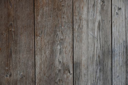 Old vintage rustic aged antique wooden sepia panel with vertical gaps, planks and chinks