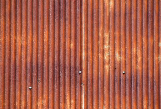 Old vintage bright rusty stained corroded metal goffered surface