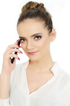Young girl holding phone in her hand. Neat office lady wearing elegant white blouse.