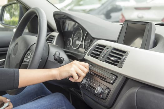 close-up of a girl's hand on the dashboard in a car