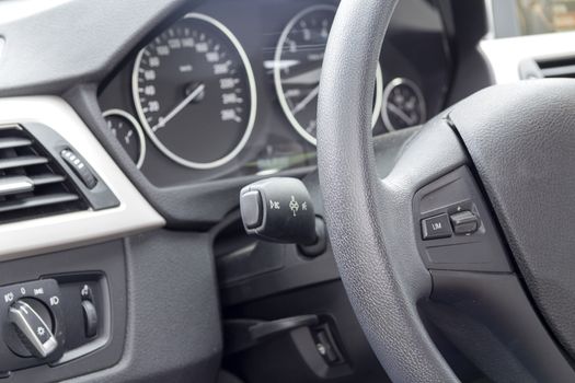 The Interior of the car with the steering wheel and dashboard car close-up