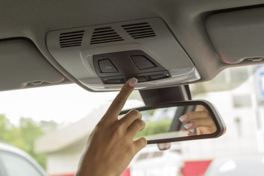 close-up of a girl's hand on the dashboard in a car