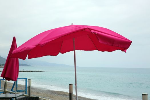 Pink Parasol By The Sea at Roquebrune-Cap-Martin, France
