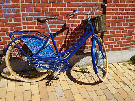 Vintage Classical  blue Bicycle in front of an old house Denmark                