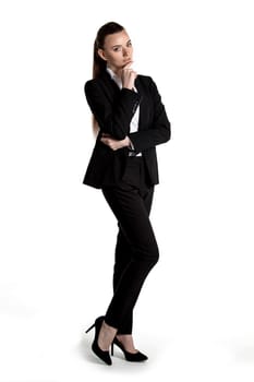 Portrait of young businesswoman in black suit isolated on white background