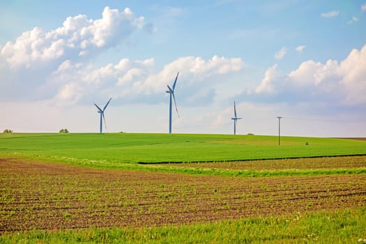 Windmills, eco power, wind turbines on farmland