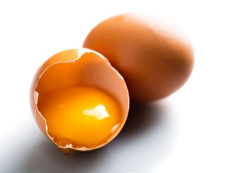 brown smashed chicken eggs on a white background