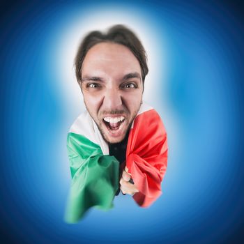 Italian soccer Fan holding the flag of Italy excited and happy for his team