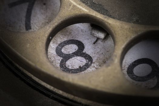 Close up of Vintage phone dial, dirty and scratched - 8, perspective