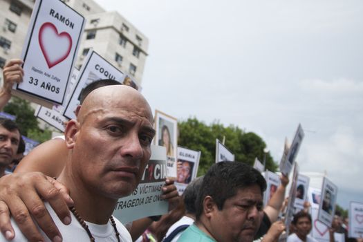 ARGENTINA, Buenos Aires: Protesters calling for justice wait anxiously outside a court in Buenos Aires, Argentina on December 29, 2015 as defendants in the infamous train crash at Once Station are sentenced to prison. The accident, which left 51 people dead, occurred on February 22, 2012. Former Transport Secretary Juan Pablo Schiavi got eight years in prison; his predecessor, Ricardo Jaime, got six years; the train's operator, Marcos Cordoba, got three years and six months in prison, and cannot operate a train for seven years. The Cirigliano brothers, suspected of having kept government subsidies that were to be spent on train maintenance, were also sentenced. Sergio Cirigliano got nine years in prision; and his brother, Roque, got five years; their brother, Mario, was acquitted.