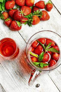 Glass decanter with delicious strawberry compote of fresh berries