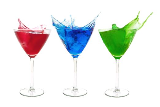 Three different cocktails with a splash over a white background