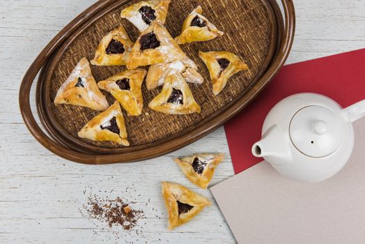 Tea, buns with jam are on the table