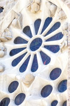 BARCELONA, SPAIN - MAY 13, 2016 : Details of Sagrada Familia, church  designed by Spanish architect Antoni Gaudi. Catholic church still built since March 1882, is a combination of Gothic style and curvilinear Art Nouveau forms.