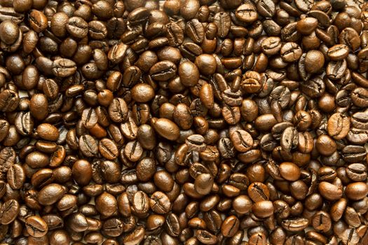 the texture of the coffee beans roasted Brown background