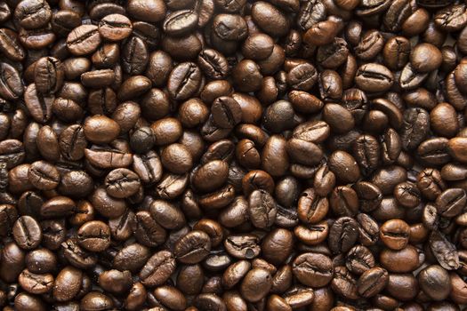 the texture of the coffee beans roasted Brown background