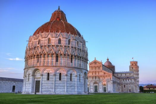 Piazza del Duomo o dei Miracoli or Cathedral Square of Miracles, Baptistery by sunset, Pisa, Italy, hdr