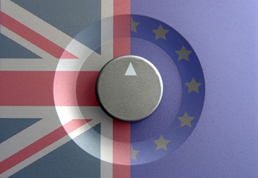 Dial pointer inbetween British and European flags with brexit question