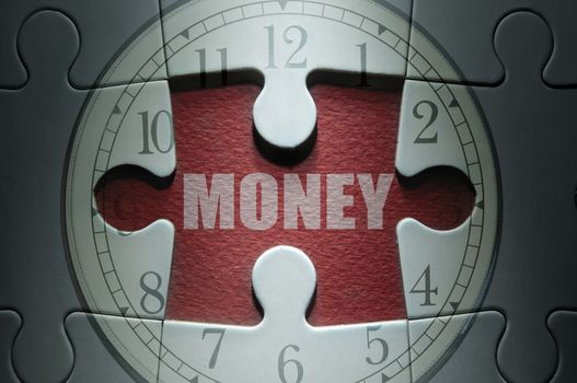 Missing piece from a clock jigsaw puzzle with money in the center 