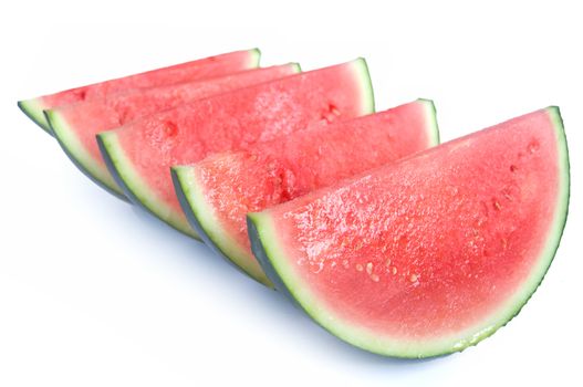 Fresh watermelon slices over a white background