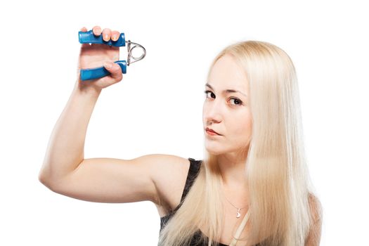 Fitness blond girl exercising her arm with a spring grip tool