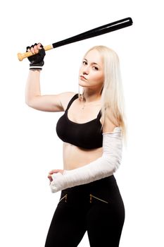 Blond girl with a broken arm in plaster, holding baseball bat