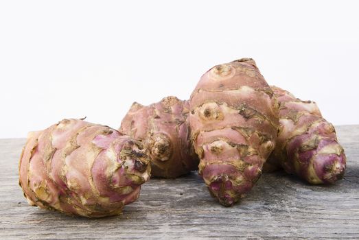 Topinambur root  also known as Jerusalem artichoke (Helianthus tuberosus). Edible rhizome native to North America with a taste similar to the artichoke.