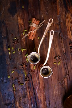 two Turk coffee on a wooden background with spices