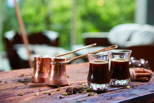 Traditional Arabic coffee. Traditional Arabic coffee. Two copper pots and two glass cups