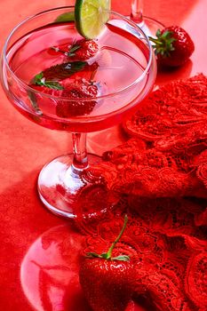 Martini glass with strawberries and red lace