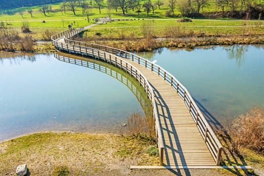 Pier / path over river through rural landscape