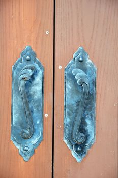 Fragment of old door with lock and door handles