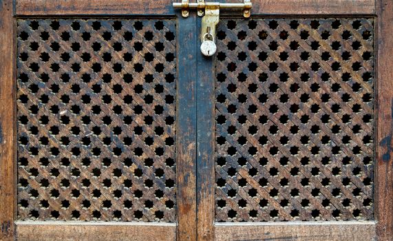 Locked wooden Nepalese door and window called Ankhi jhyal