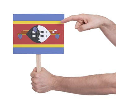 Hand holding small card, isolated on white - Flag of Swaziland