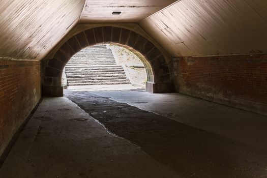 A pedestrian tunnel of a walkway in a park