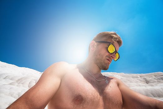 Selfie of man in Pammukale near modern Turkey city Denizli, Turkey