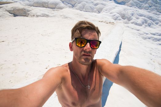 Selfie of man in Pammukale near modern Turkey city Denizli, Turkey