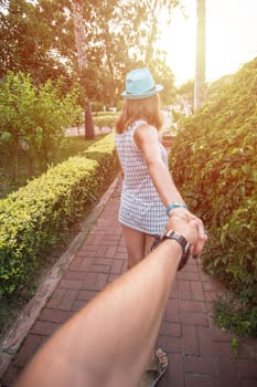 Girl holding a hand man on the street in Alanya, Turkey