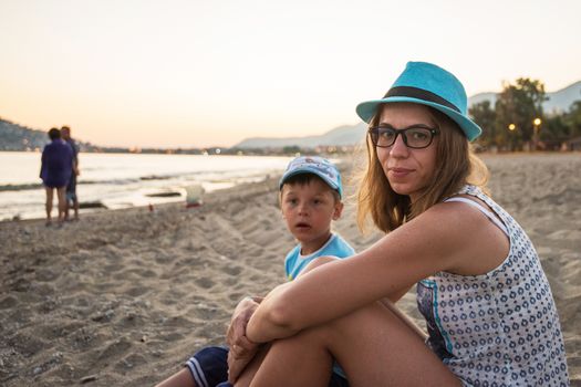 Mother and son at Alanya beach, view from the beach, one of the famous destinations in Turkey.