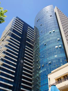 Modern urban city landscape of skyscrapers with clear blue sky background